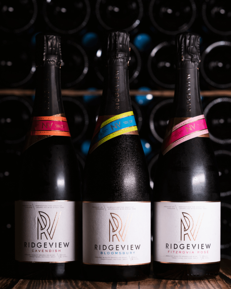 Ridgeview Wine Estate, English Sparkling Wine, 3 Bottles in front of racked bottles behind